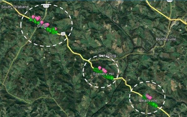 A satellite map with a yellow road passing through towns labeled Glyde, Scenery Hill, and Beallsville. Pink and green markers cluster in each town, with dashed white circles highlighting the areas. Nearby towns are labeled.